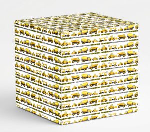 A gift box covered in personalised white wrapping paper decorated with yellow construction vehicles and text saying Happy 8th Birthday with a custom name