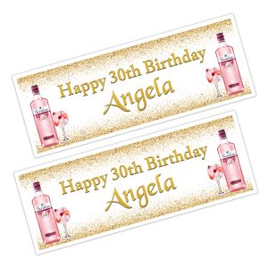 Bottles on pink gin on a happy birthday banner