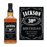 a bottle of alcohol with a black label with Jack Daniel's in the background