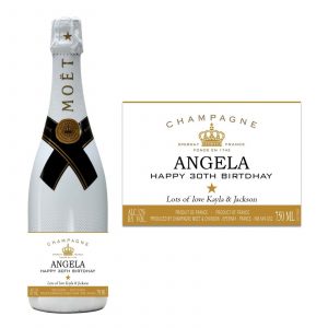 a bottle of moet champagne with a personalised label saying happy birthday and a name