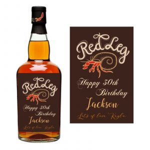 a bottle of liquor with a label with red leg spiced in the background