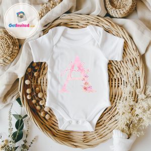 white baby vest with a big letter and name on the front