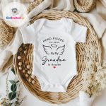 white baby vest with wording about nanny and grandad picking a baby from heaven