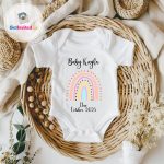 cute rainbow and name on a baby vest
