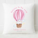 Personalised 40cm white nursery pillow featuring a watercolour pink hot air balloon, a cute bear, and custom baby name with birth date.