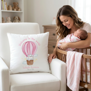 Personalised 40cm white nursery pillow featuring a watercolour pink hot air balloon, a cute bear, and custom baby name with birth date.
