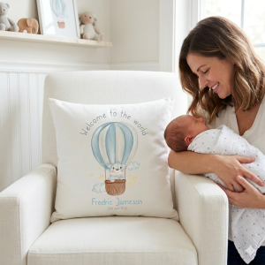Personalised 40cm white nursery pillow featuring a watercolour blue hot air balloon, a cute bear, and custom baby name with birth date.