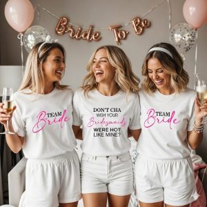 women getting ready for hen party with matching shirts on